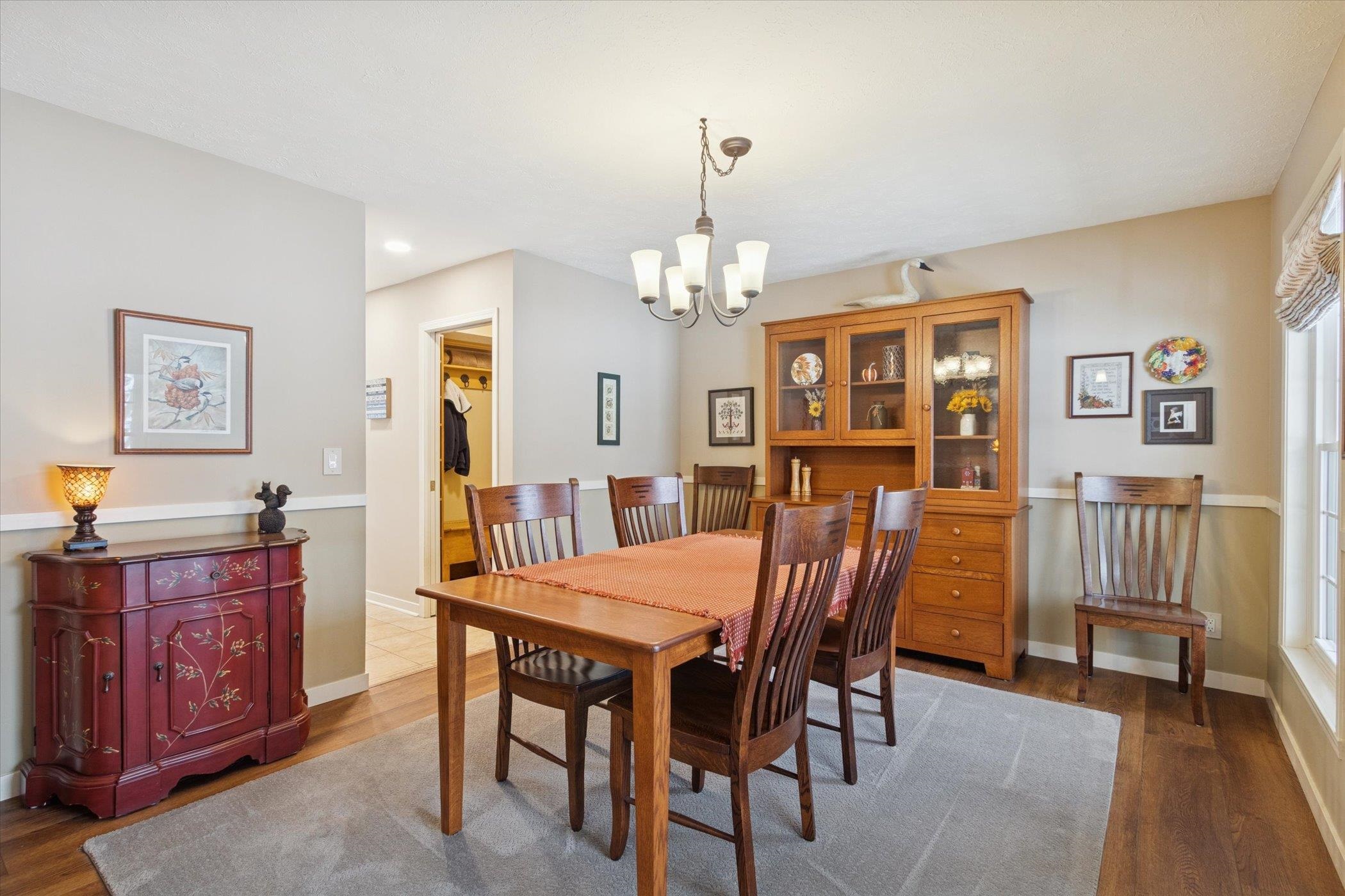 10906 Hamborg Road Roscoe, IL 61073 - Photo 13 of 65 a view of a dining room with furniture and chandelier