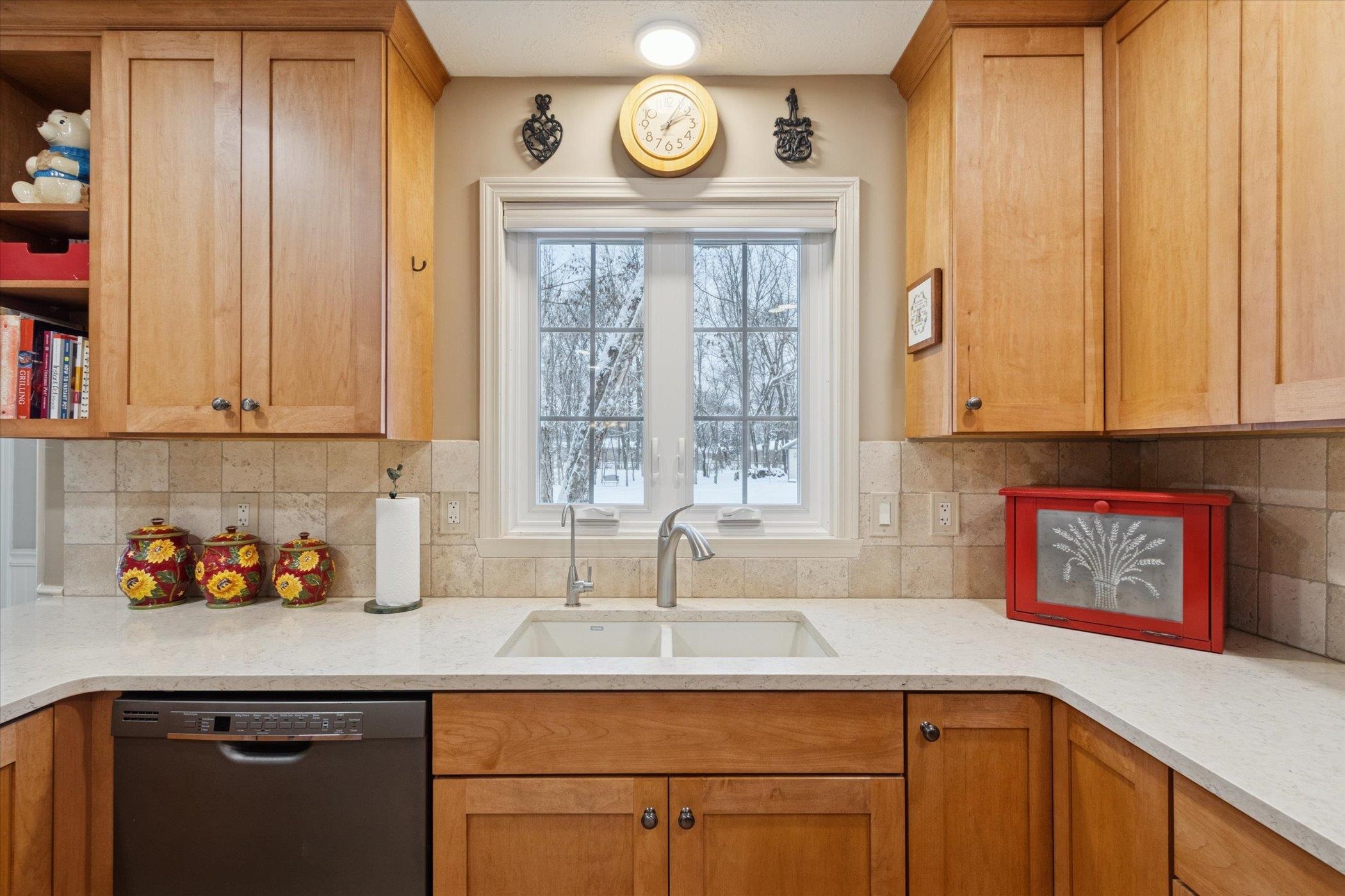 10906 Hamborg Road Roscoe, IL 61073 - Photo 16 of 65 a kitchen with stainless steel appliances granite countertop a sink a cabinets and a window