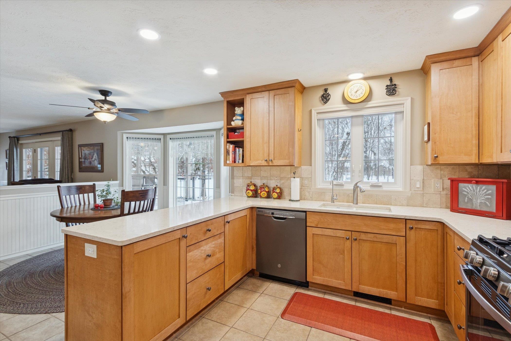 10906 Hamborg Road Roscoe, IL 61073 - Photo 17 of 65 a large kitchen with stainless steel appliances granite countertop a sink and cabinets