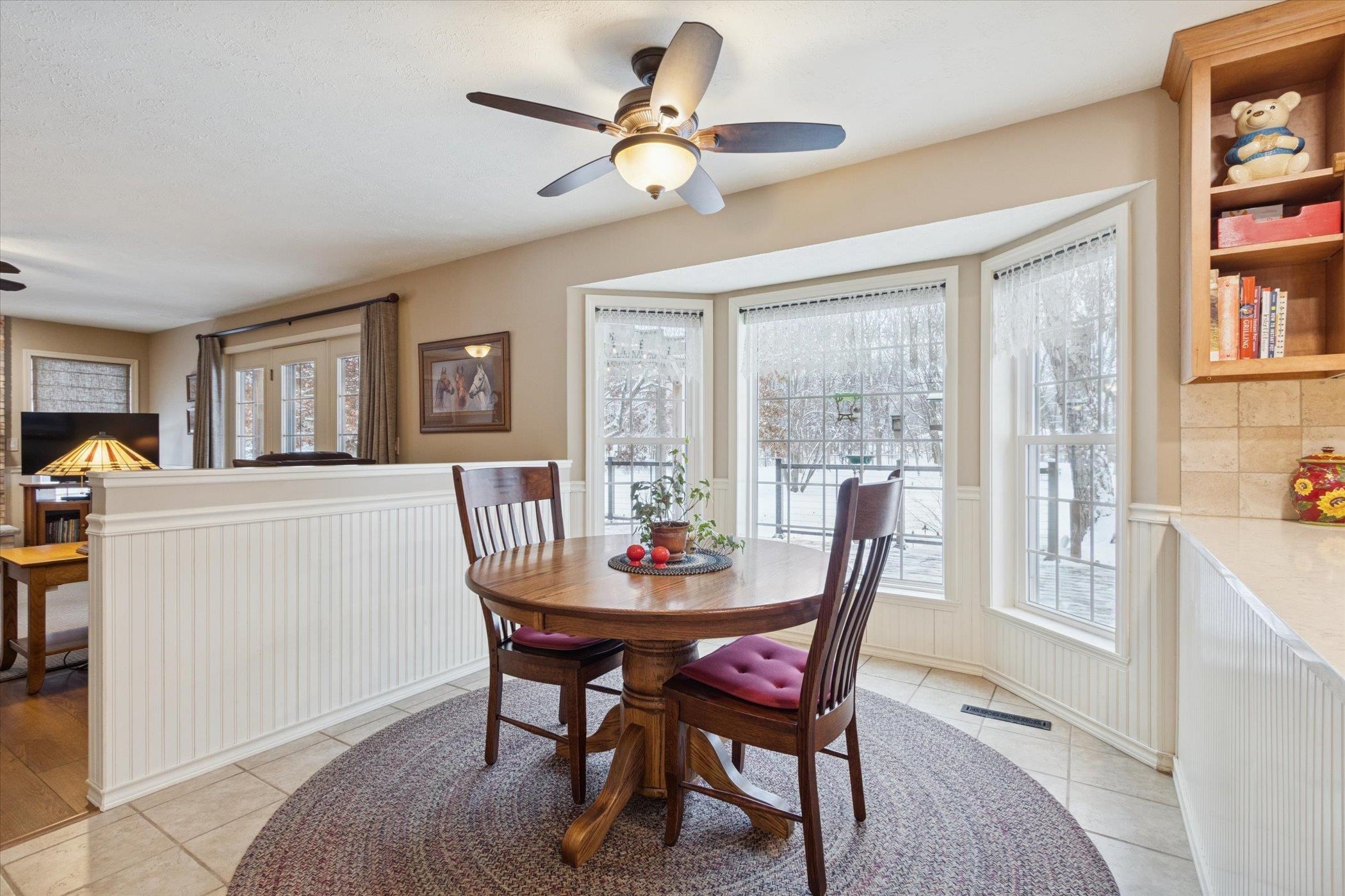 10906 Hamborg Road Roscoe, IL 61073 - Photo 19 of 65 a dining room with furniture a window and a chandelier
