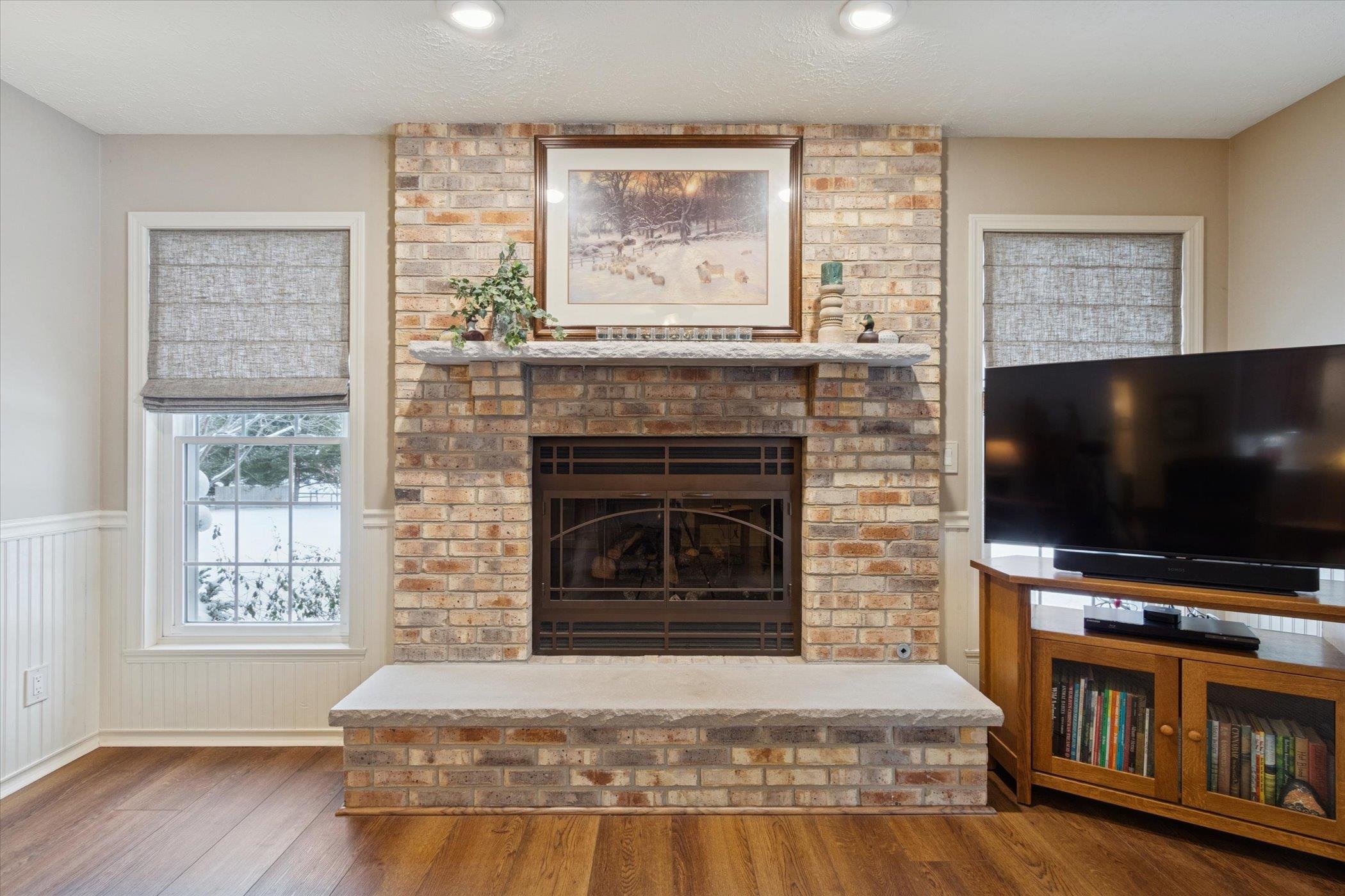 10906 Hamborg Road Roscoe, IL 61073 - Photo 23 of 65 a living room with a flat screen tv and a fireplace