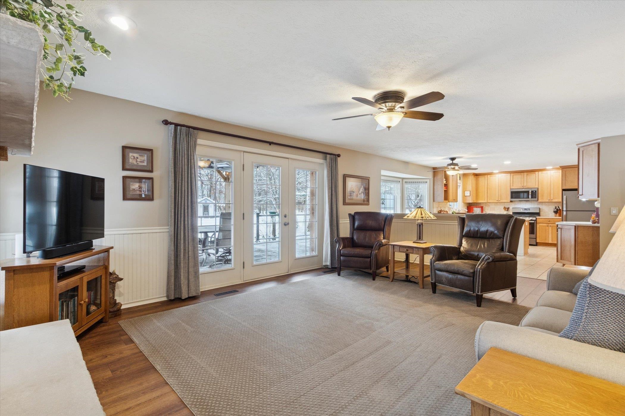 10906 Hamborg Road Roscoe, IL 61073 - Photo 24 of 65 a living room with furniture and a flat screen tv