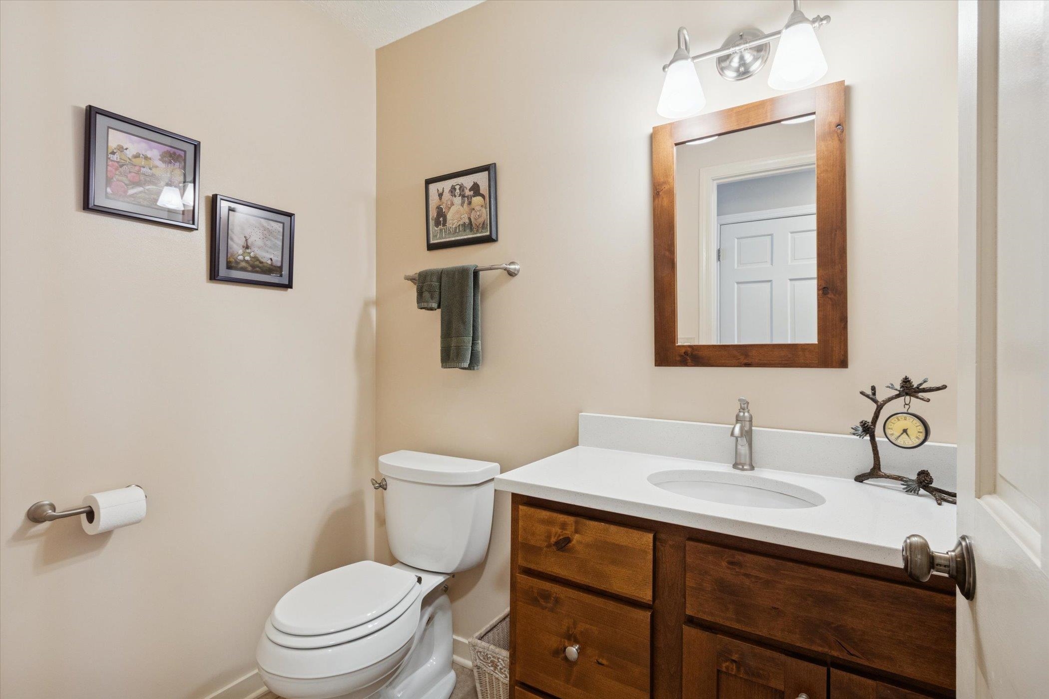 10906 Hamborg Road Roscoe, IL 61073 - Photo 26 of 65 a bathroom with a toilet sink and mirror