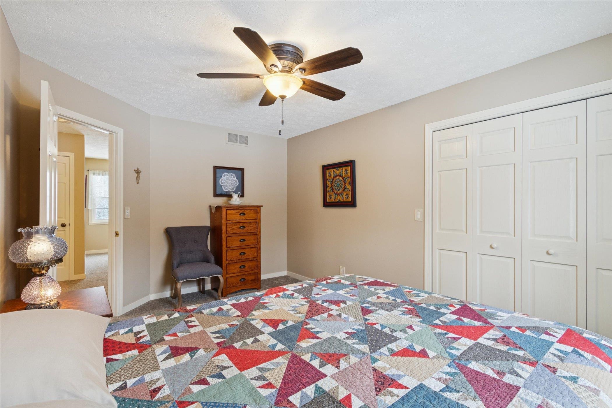 10906 Hamborg Road Roscoe, IL 61073 - Photo 28 of 65 a bedroom with a bed and wooden floor