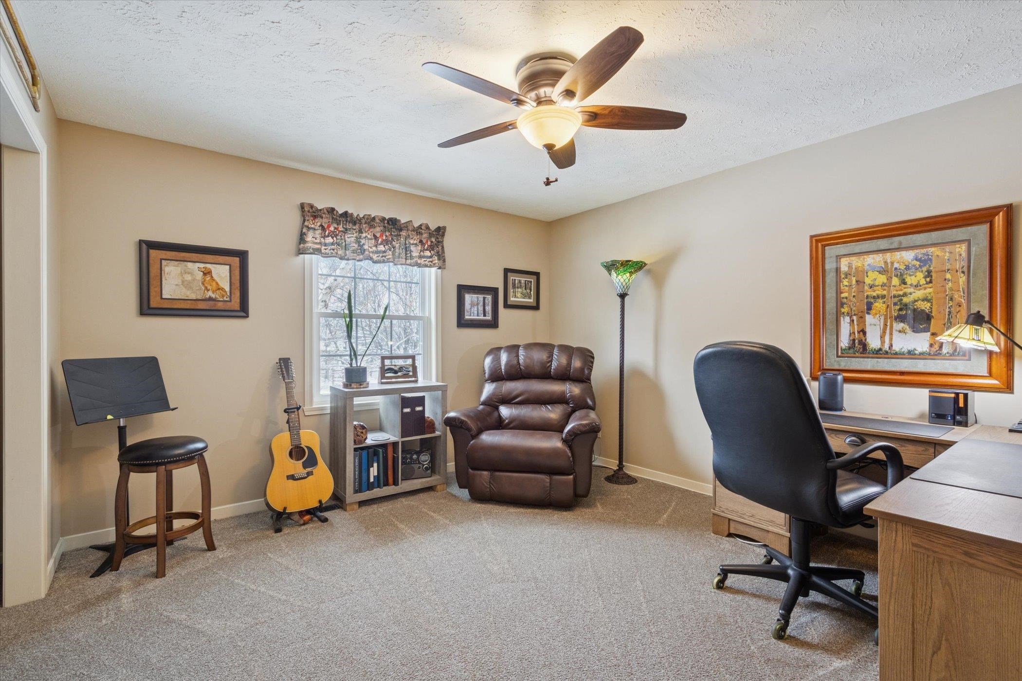 10906 Hamborg Road Roscoe, IL 61073 - Photo 29 of 65 a view of a workspace with furniture and a window