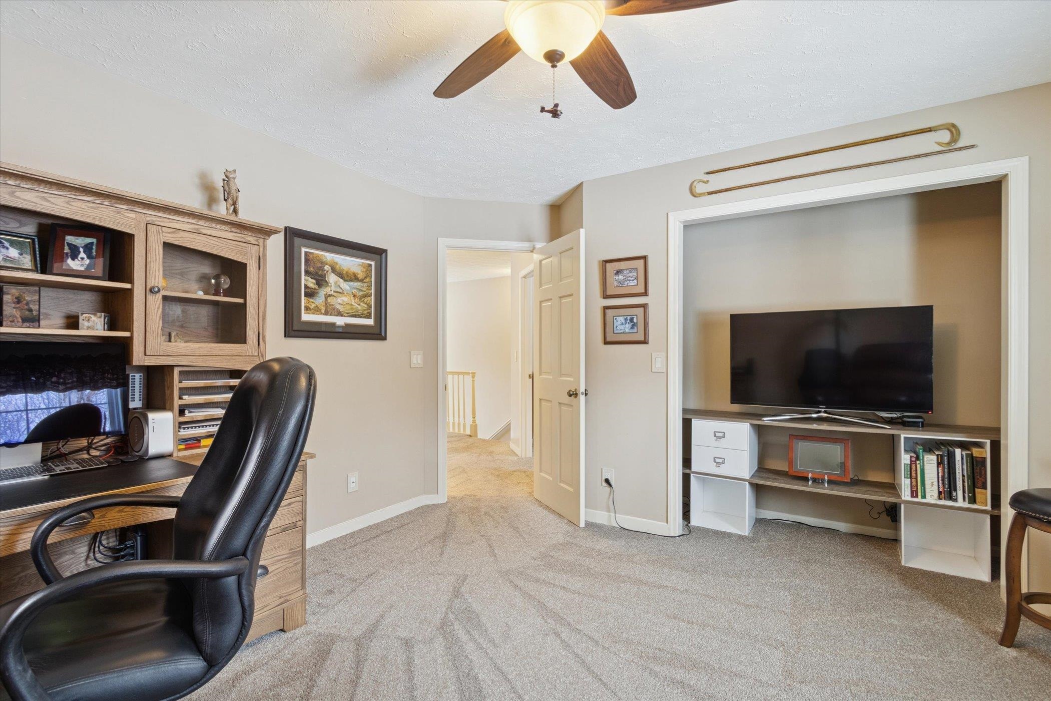 10906 Hamborg Road Roscoe, IL 61073 - Photo 30 of 65 a view of a livingroom with furniture and a flat screen tv
