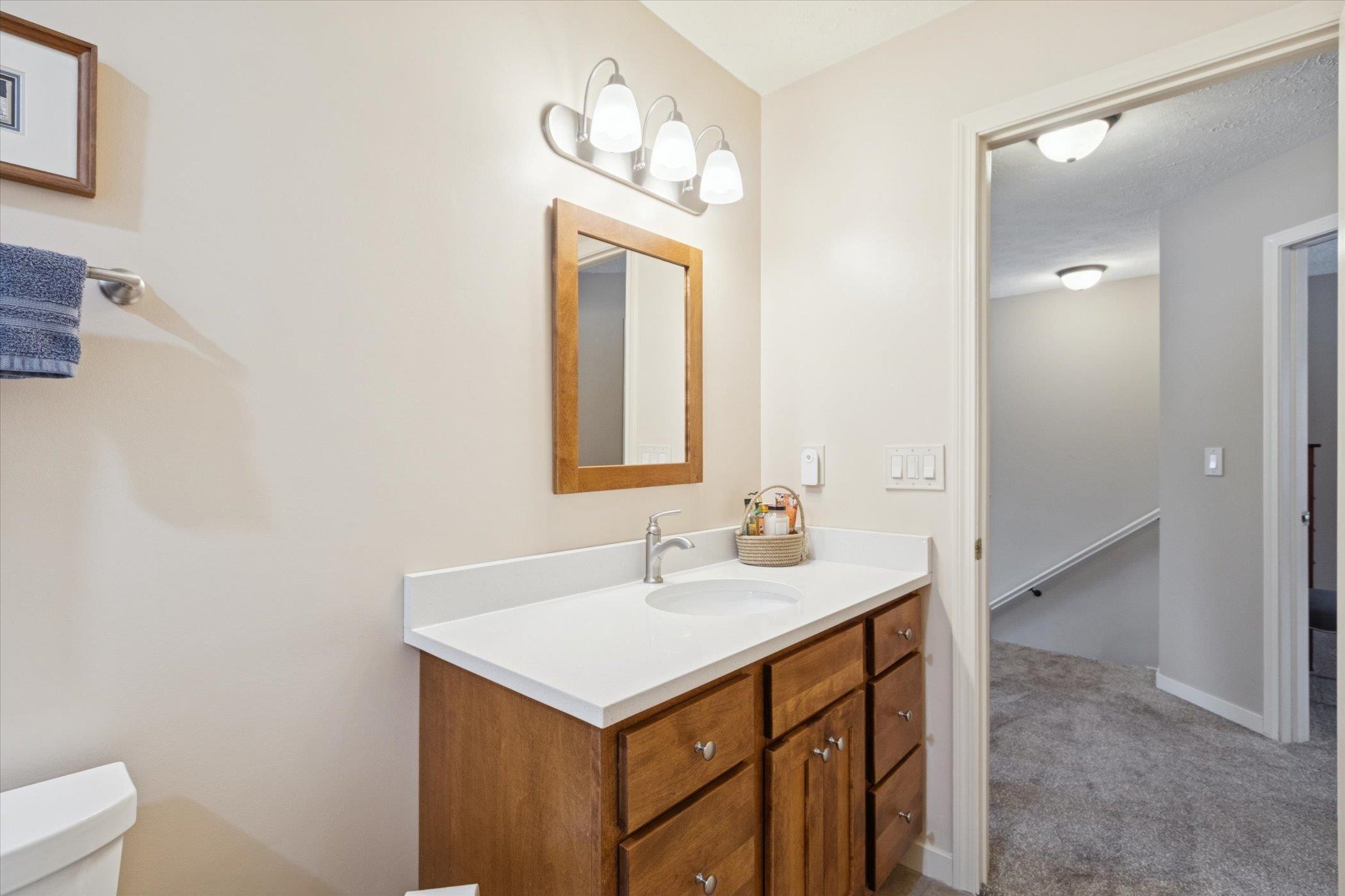 10906 Hamborg Road Roscoe, IL 61073 - Photo 34 of 65 a bathroom with a sink and a mirror