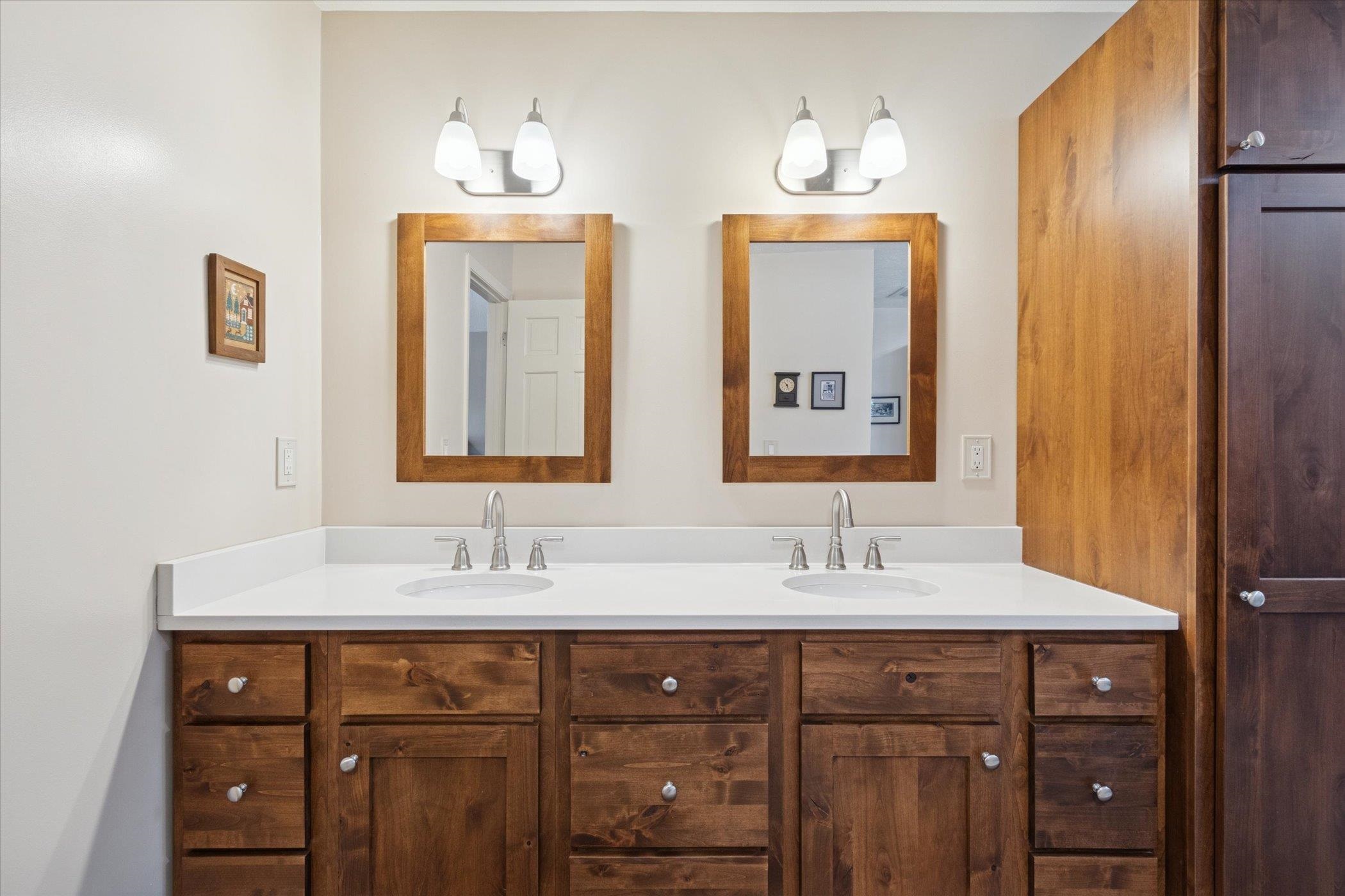 10906 Hamborg Road Roscoe, IL 61073 - Photo 39 of 65 a bathroom with a double vanity sink and a mirror