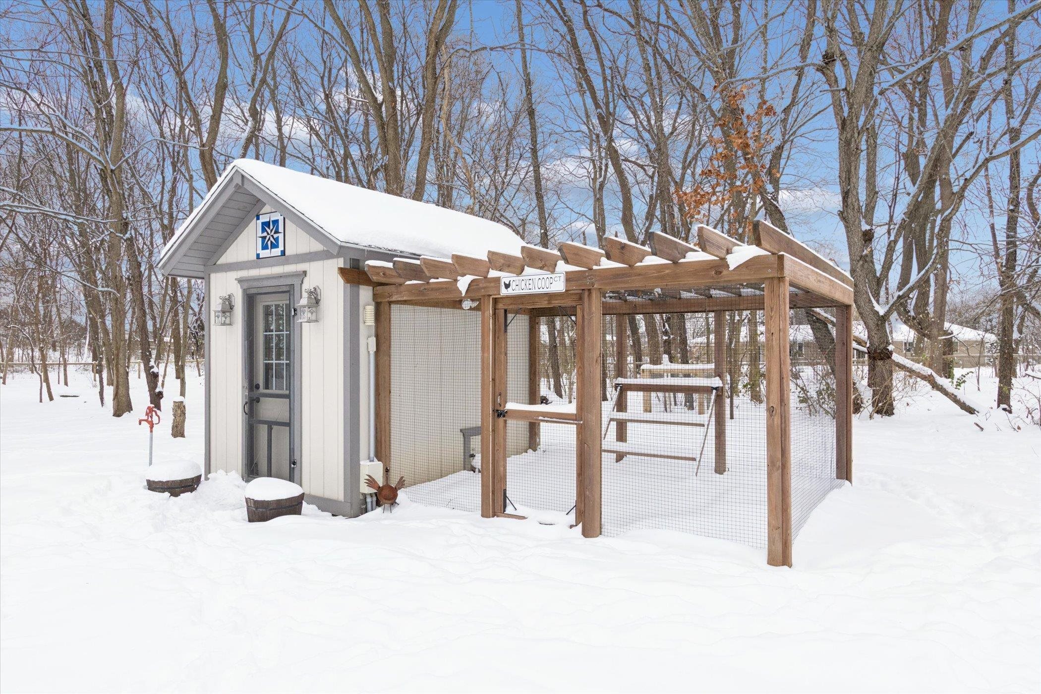 10906 Hamborg Road Roscoe, IL 61073 - Photo 57 of 65 a view of a house with a snow on the road