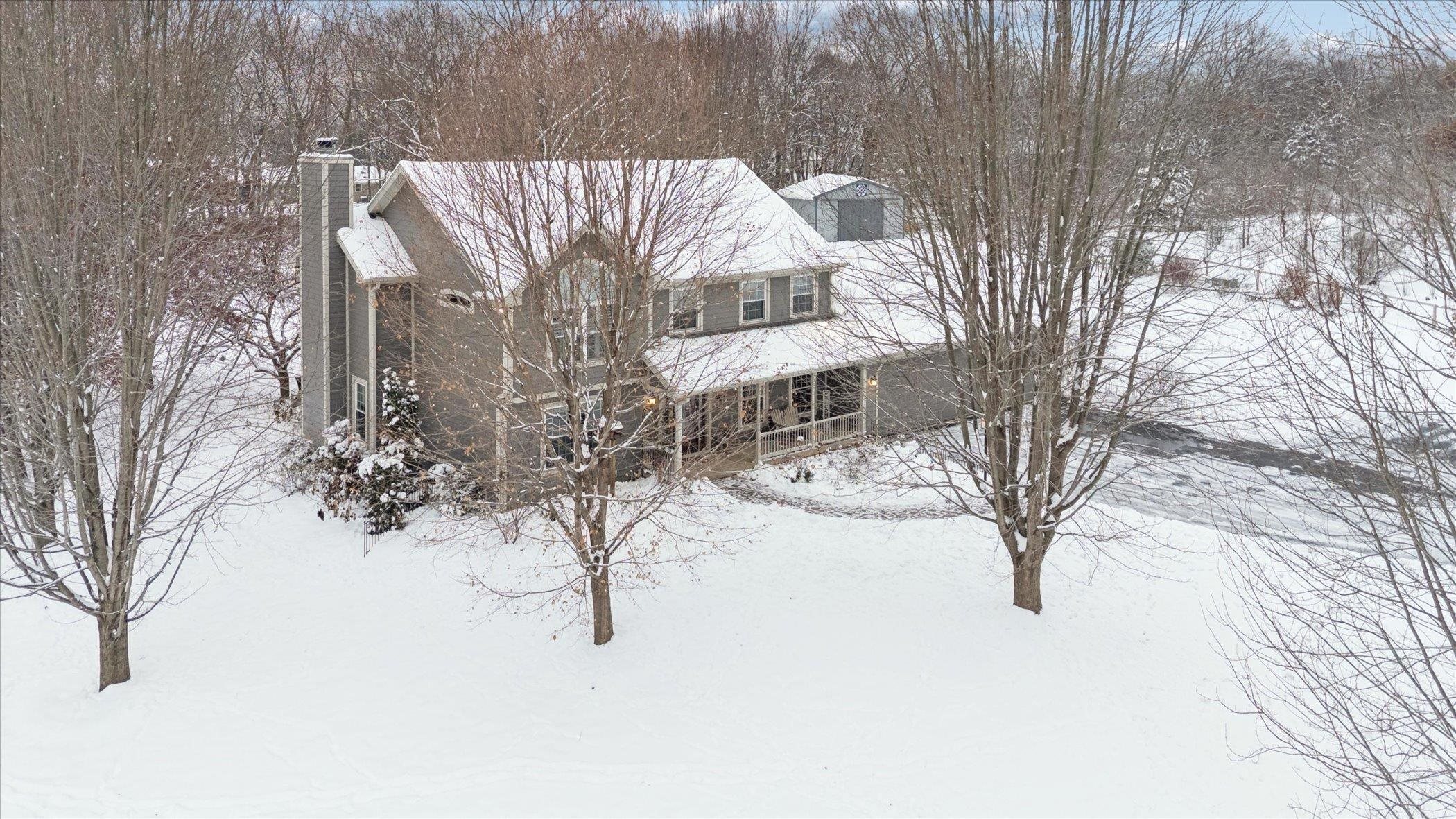 10906 Hamborg Road Roscoe, IL 61073 - Photo 64 of 65 a wooden bench sitting in the middle of a snow
