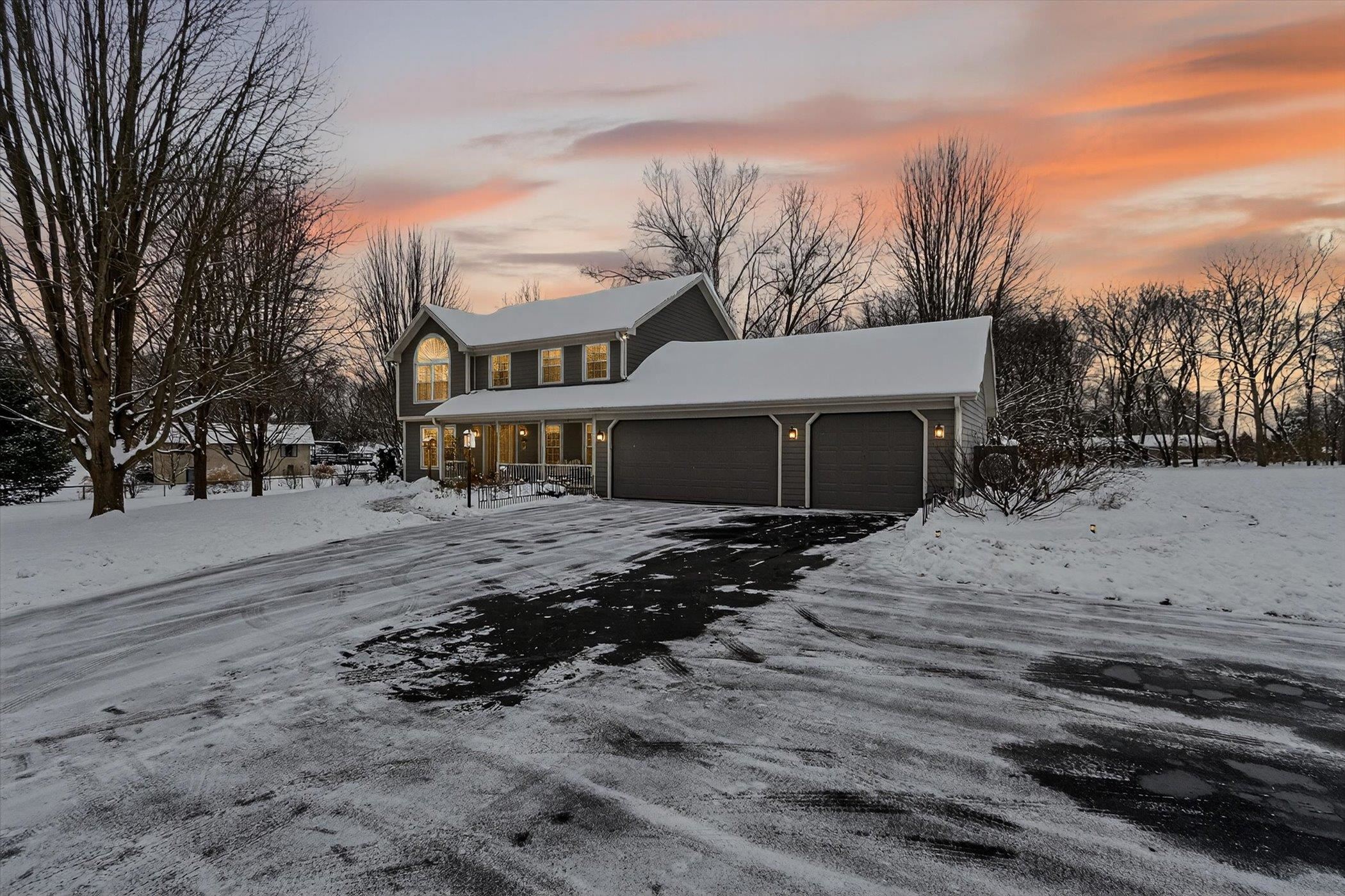10906 Hamborg Road Roscoe, IL 61073 - Photo 7 of 65 a front view of a house with a yard