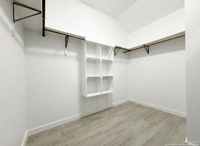a view of an empty walk in closet