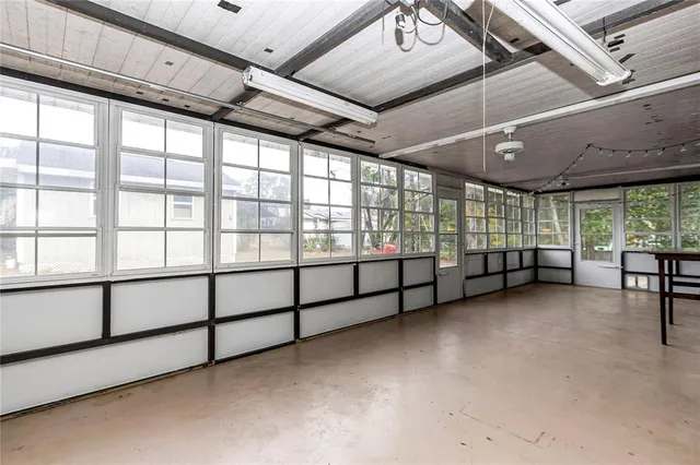 a view of an empty room with windows