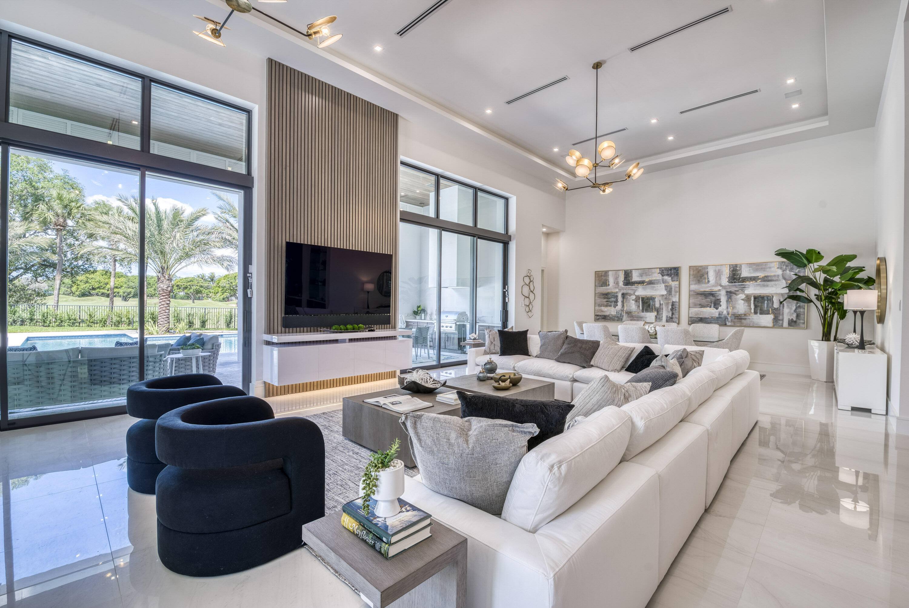 119 Clipper Lane Jupiter, FL 33477 - Photo 13 of 63 a living room with furniture a flat screen tv and a large window