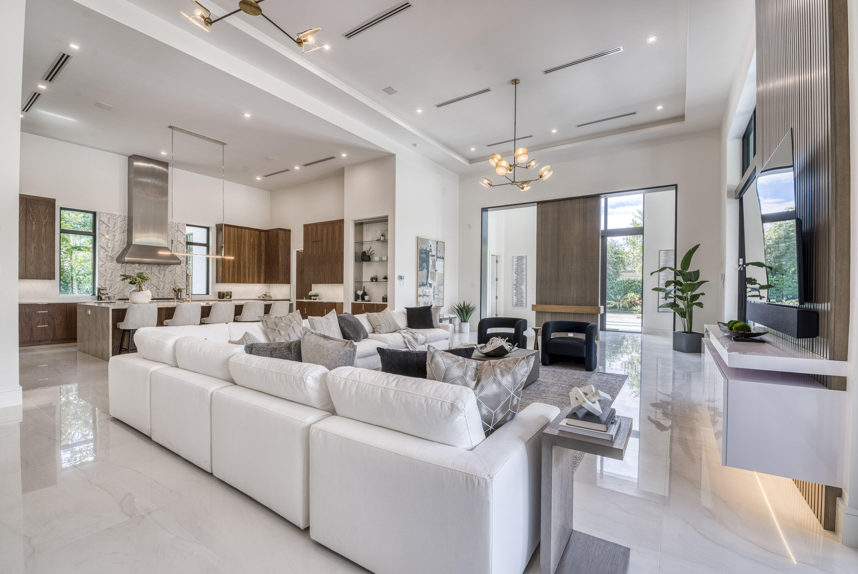 119 Clipper Lane Jupiter, FL 33477 - Photo 15 of 63 a living room with furniture kitchen view and a chandelier