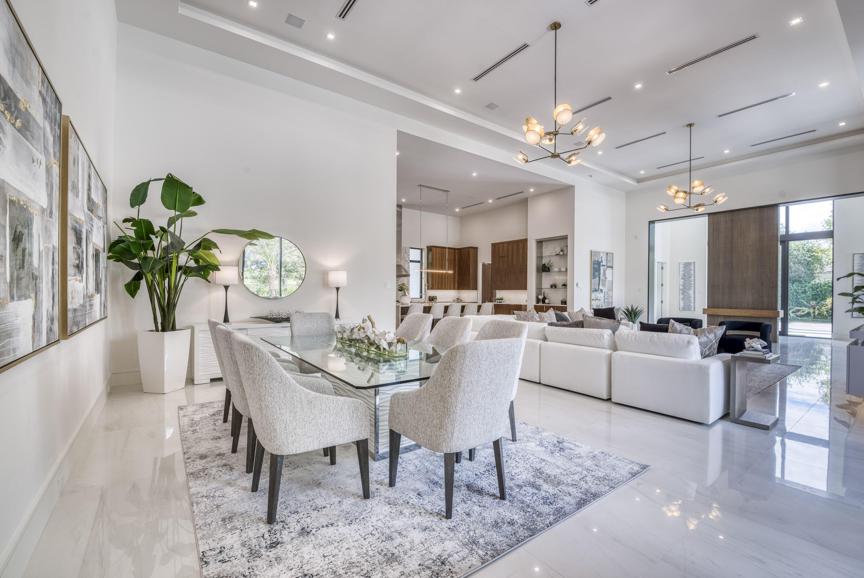 119 Clipper Lane Jupiter, FL 33477 - Photo 18 of 63 a dining room with furniture a chandelier and wooden floor