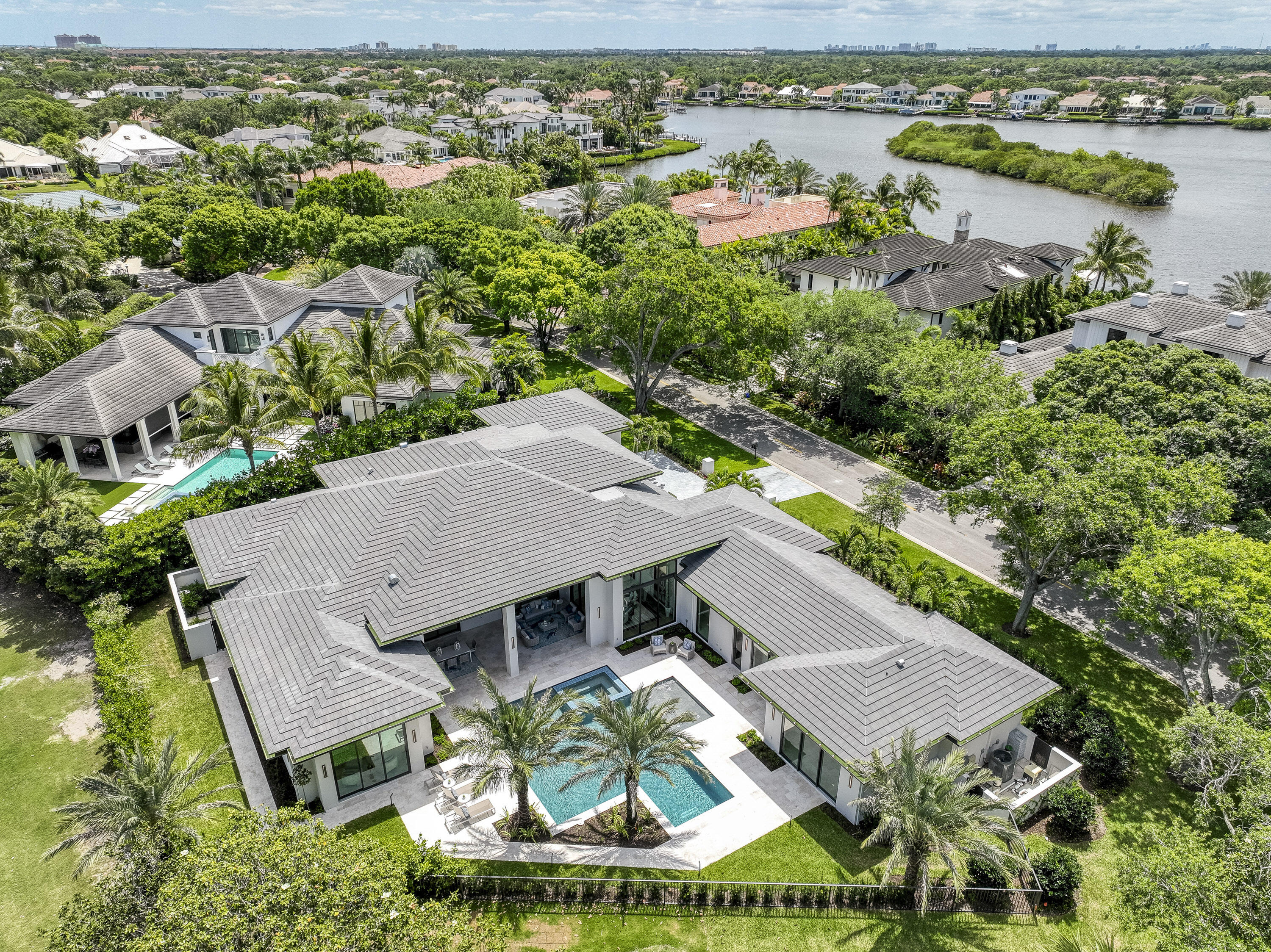 119 Clipper Lane Jupiter, FL 33477 - Photo 2 of 63 an aerial view of a house with a garden
