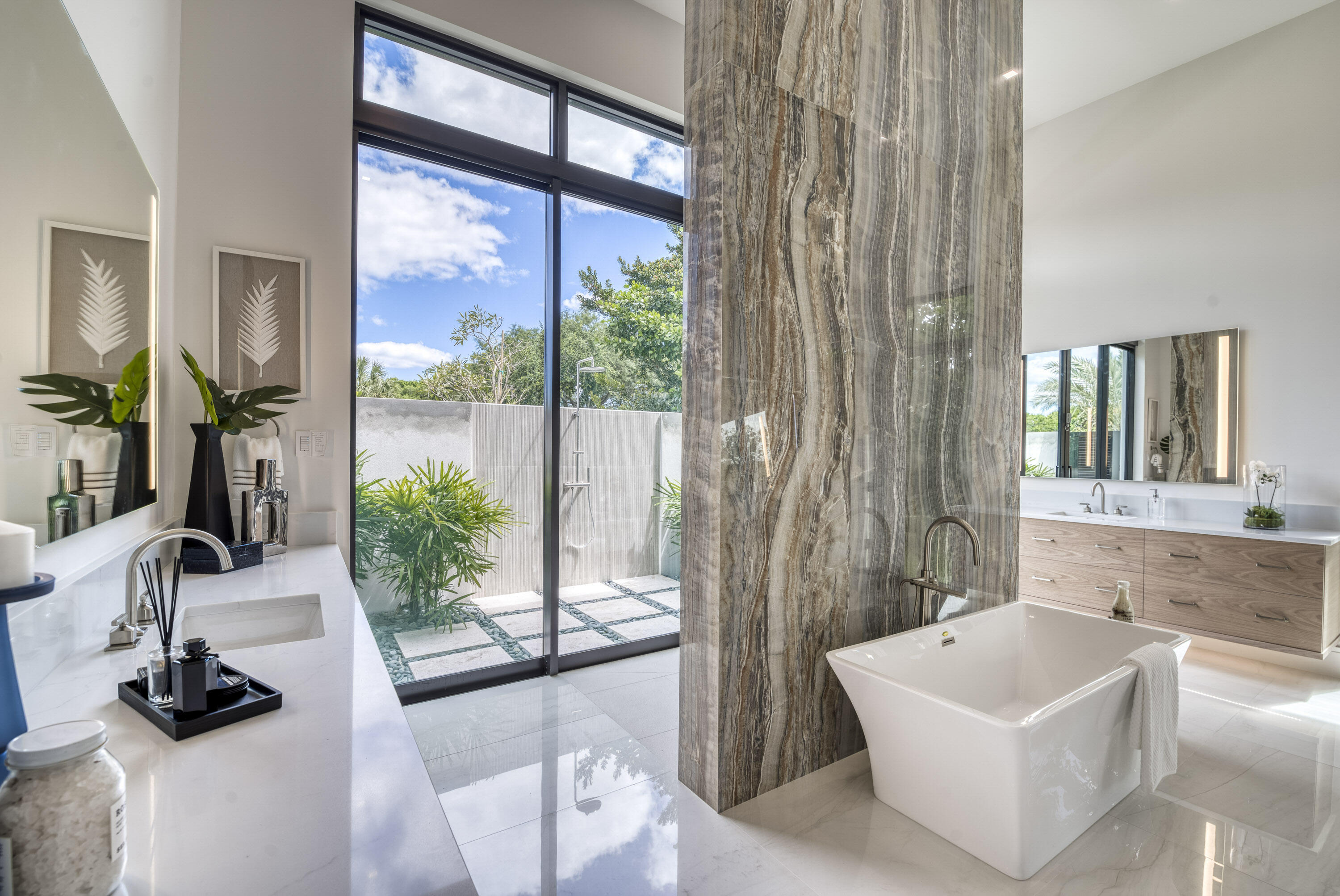 119 Clipper Lane Jupiter, FL 33477 - Photo 27 of 63 a bathroom with a tub a sink a mirror and a window