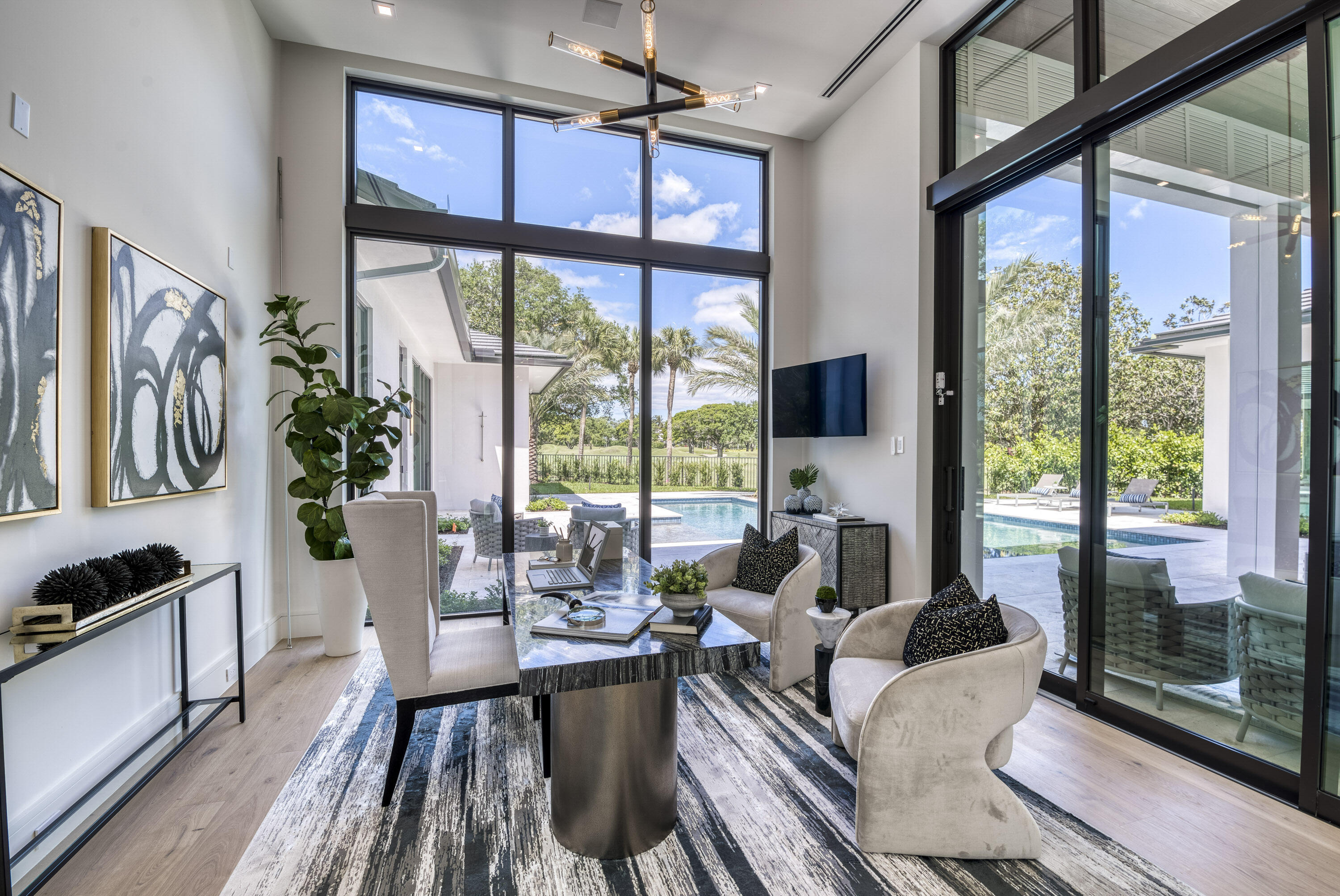 119 Clipper Lane Jupiter, FL 33477 - Photo 33 of 63 a living room with furniture large windows and wooden floor