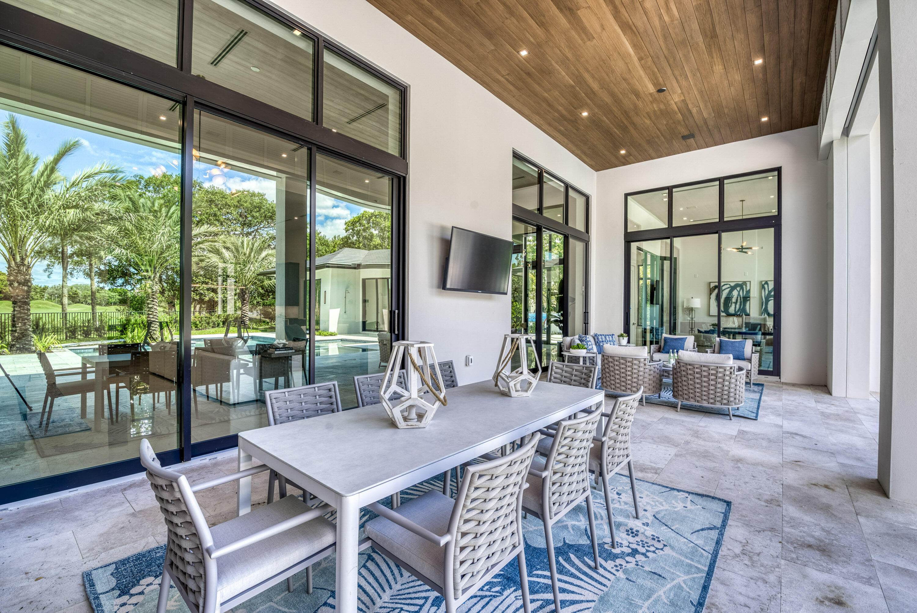 119 Clipper Lane Jupiter, FL 33477 - Photo 58 of 63 a view of a dining room with furniture large windows and wooden floor