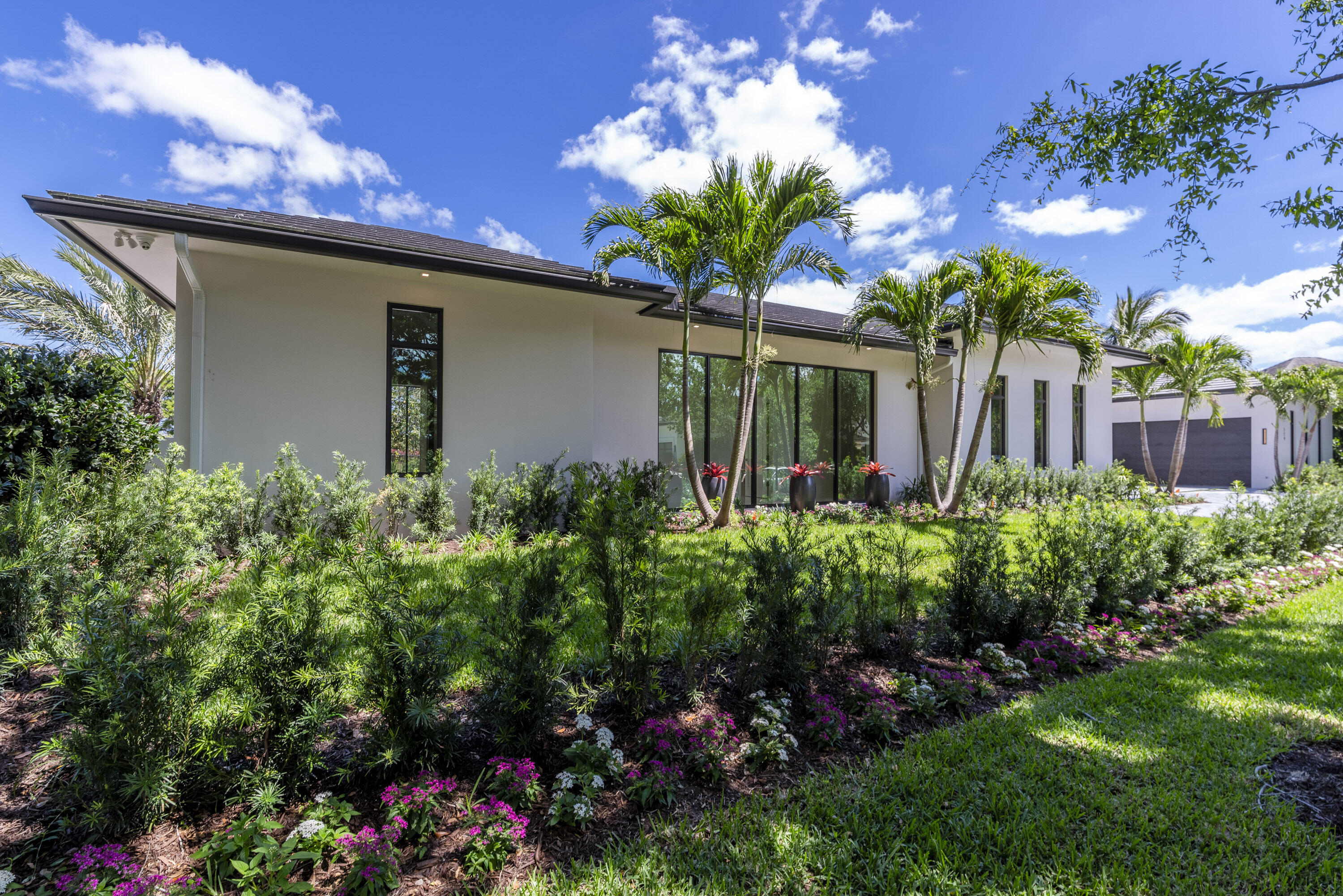 119 Clipper Lane Jupiter, FL 33477 - Photo 6 of 63 a view of a house with a flower garden