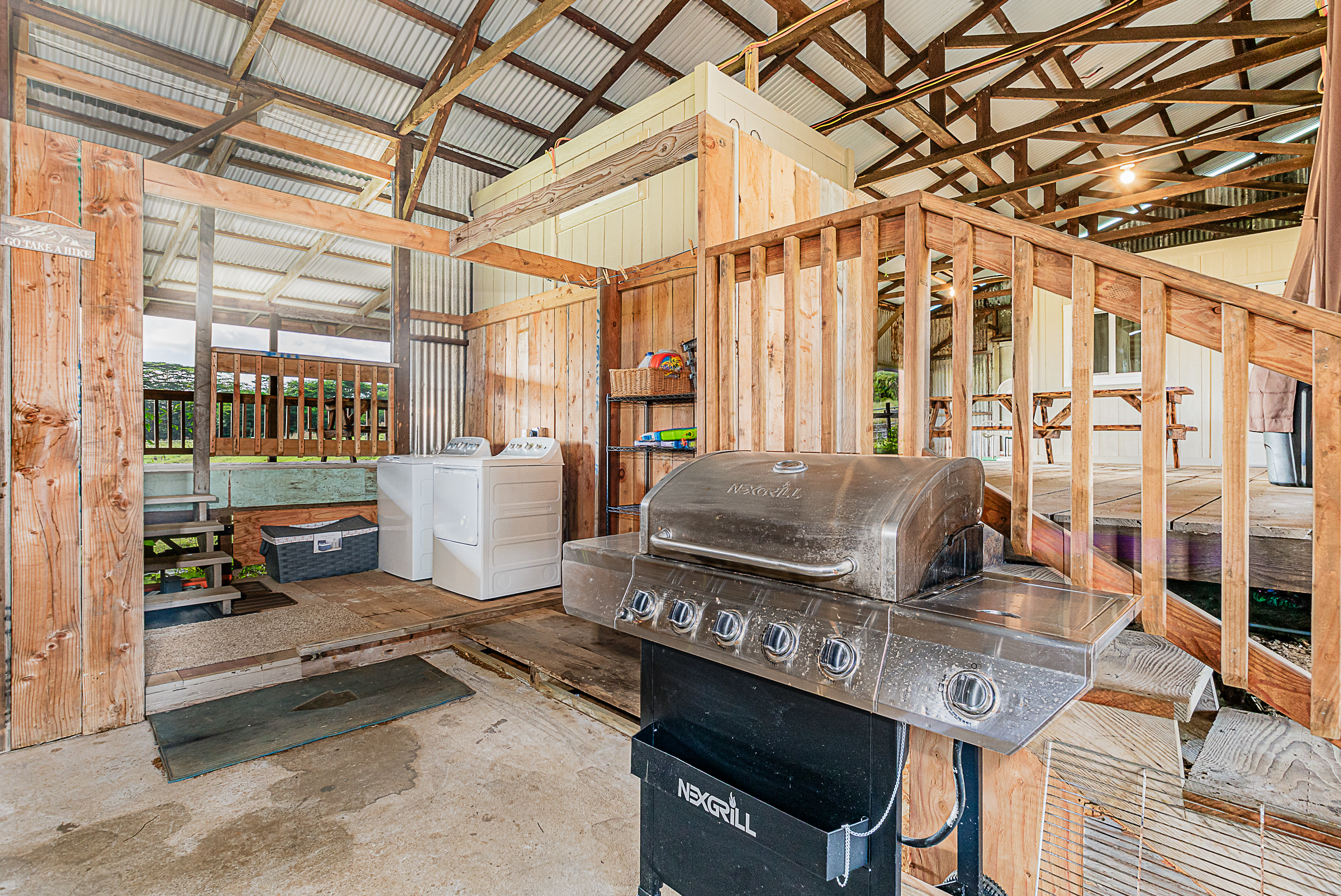 681 Hoaka Road Hilo, HI 96720 - Photo 12 of 26 a living room with furniture and a floor to ceiling window