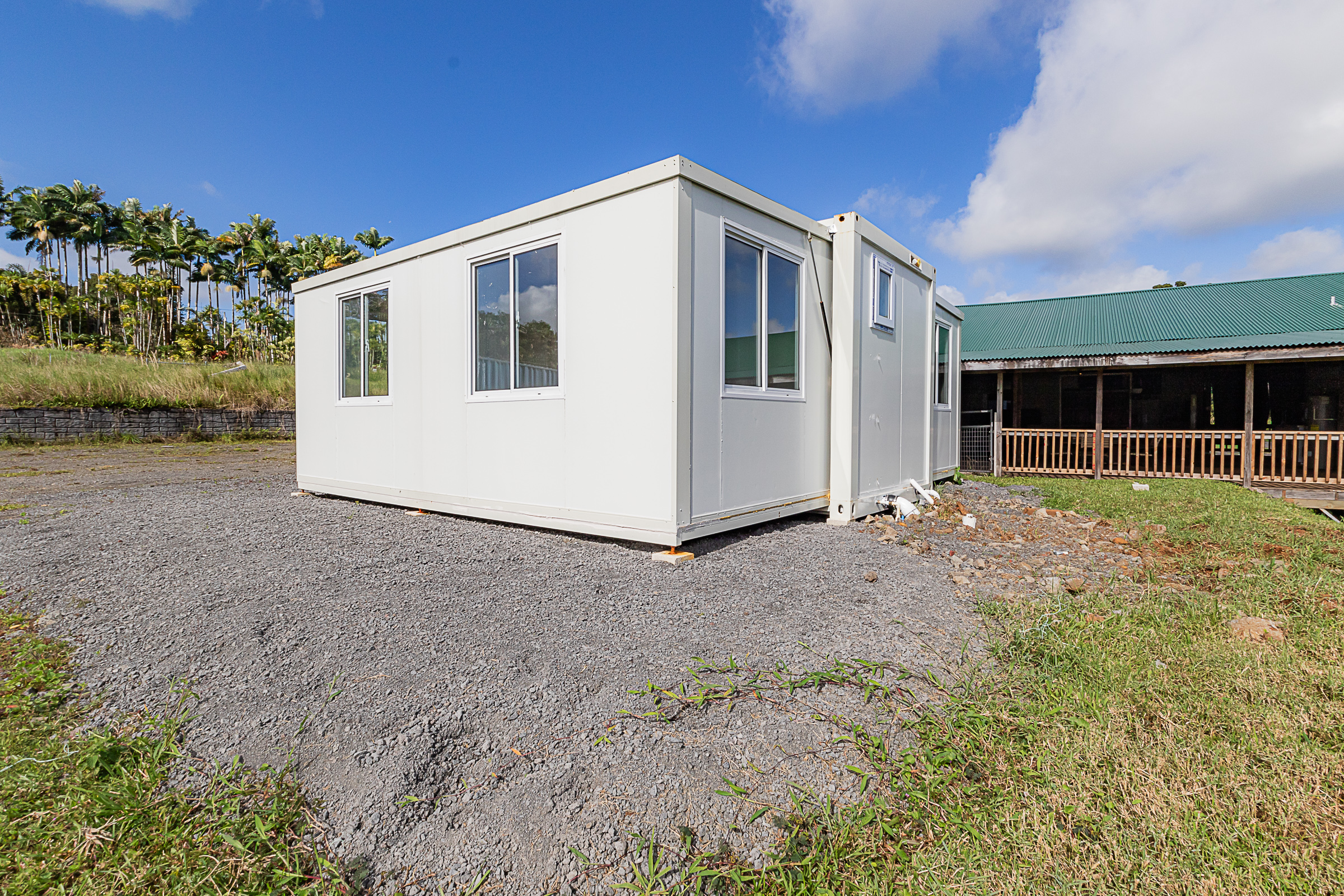 681 Hoaka Road Hilo, HI 96720 - Photo 18 of 26 a front view of a house with a yard