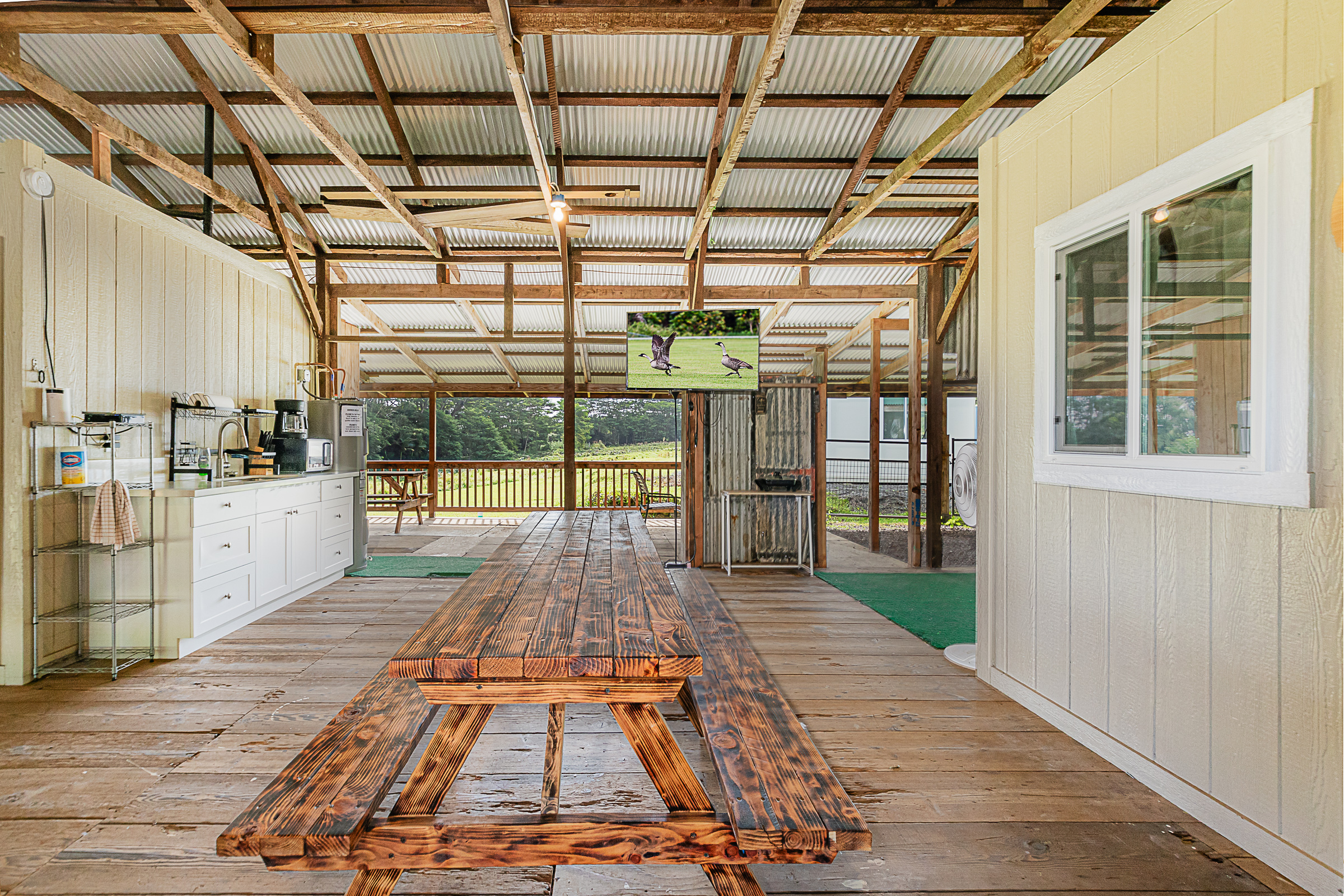 681 Hoaka Road Hilo, HI 96720 - Photo 6 of 26 a view of a porch with wooden floor