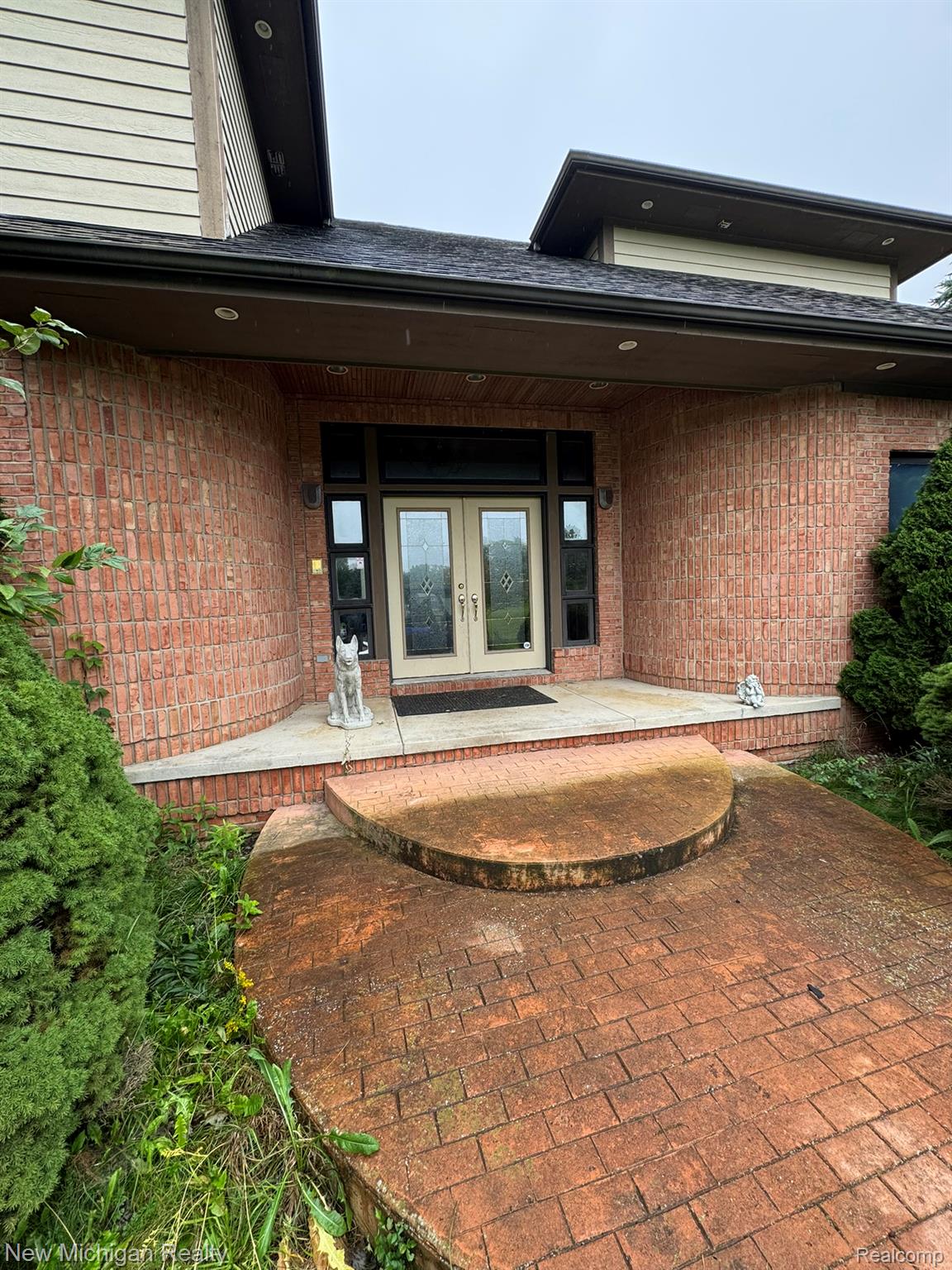 11082 Blaine Road Brighton, MI 48114 - Photo 1 of 34 Red brick exterior with horizontal siding accents