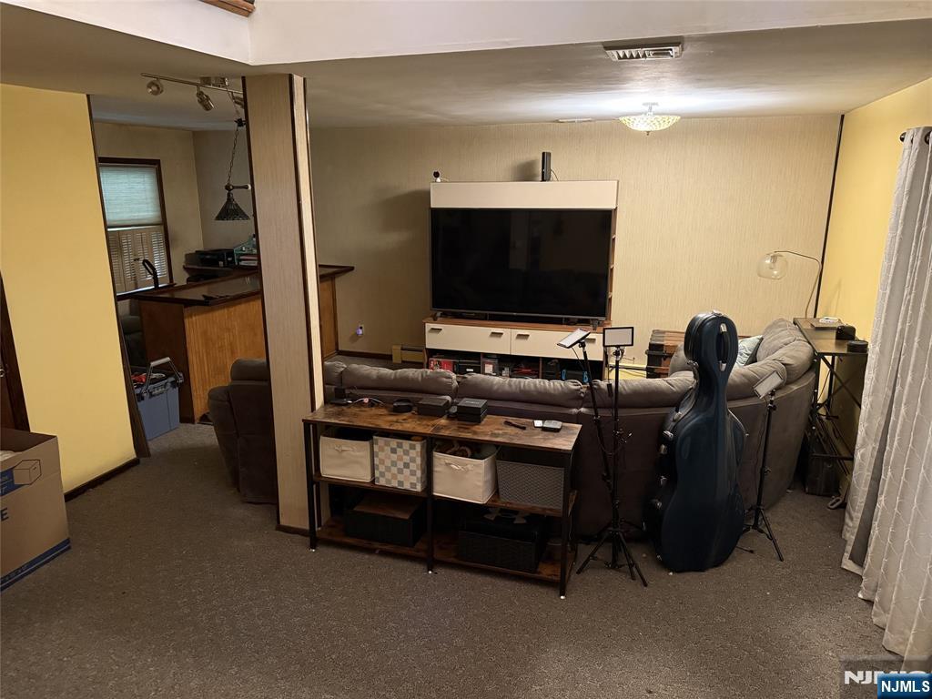 36 Lavina Trail Oak Ridge, NJ 07438 - Photo 13 of 26 a room with furniture and a flat screen tv