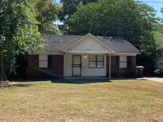 a house that has a big yard in front of it