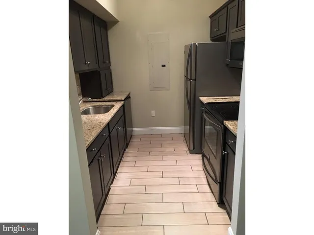 a hallway with washer and dryer