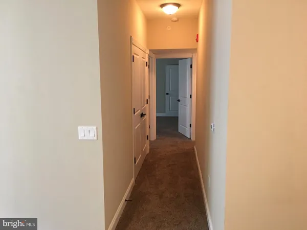 a view of a bathroom from a hallway