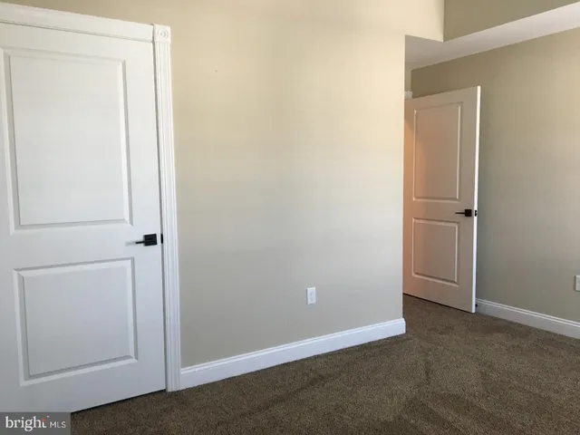 an empty room with closet area