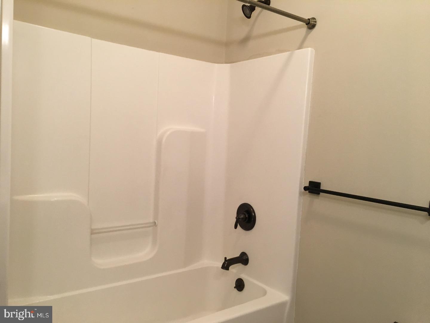 9 North 7th Street, Unit A Perkasie, PA 18944 - Photo 10 of 12 a bathroom with a bathtub