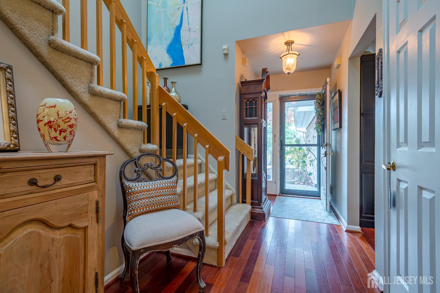 32 Springwood Court Princeton, NJ 08540 - Photo 4 of 26 a view of entryway with wooden floor and stairs
