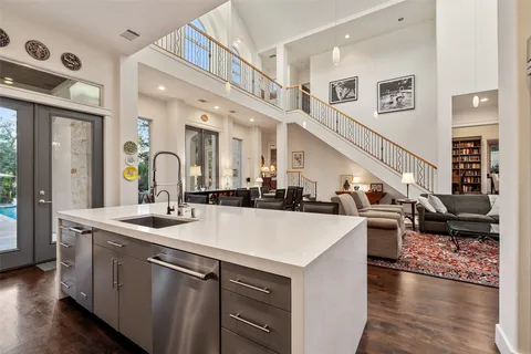a living room with furniture and a book shelf