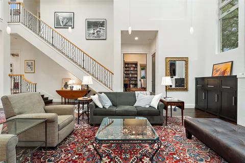 a bathroom with a sink a toilet and a window