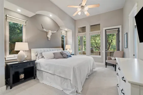 a kitchen with stainless steel appliances kitchen island granite countertop a refrigerator and a stove top oven