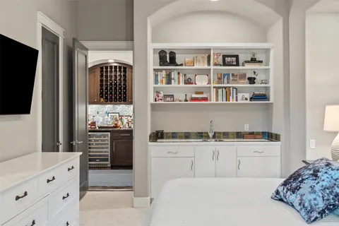 a bathroom with a granite countertop sink mirror vanity and toilet