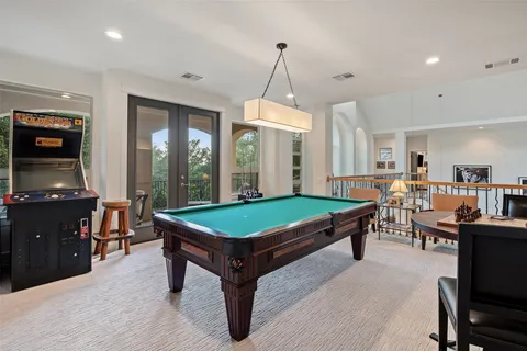 a bathroom with a sink double vanity and toilet