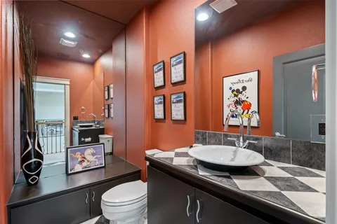 a living room with furniture pool table and a flat screen tv