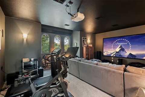 a bedroom with a bed a dresser and a book shelf