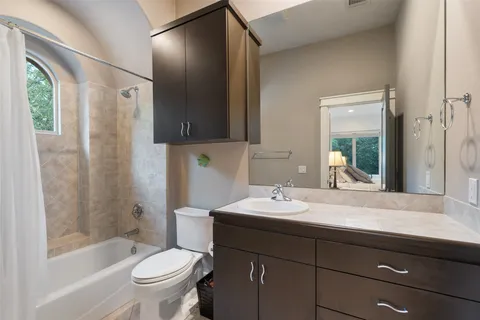 a view of backyard with seating space and trees