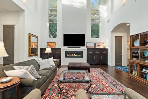 a kitchen with stainless steel appliances granite countertop a stove and a table chair