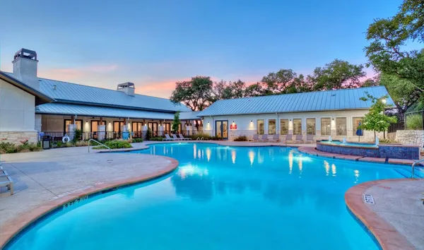 swimming pool view with a seating space