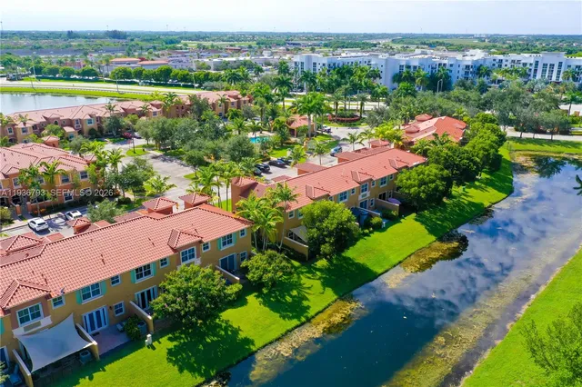 an aerial view of a houses with outdoor space and garden
