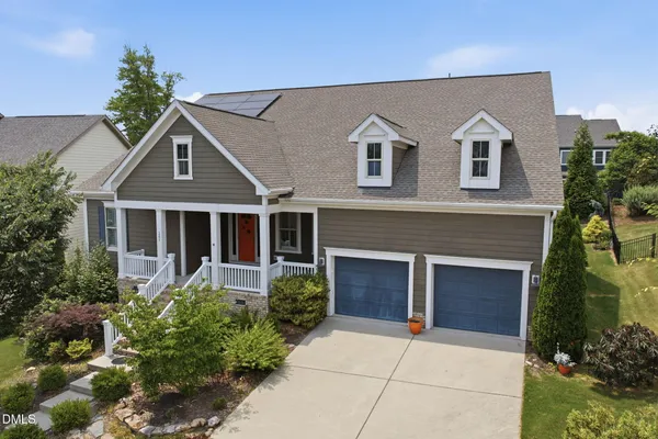 a front view of a house with yard