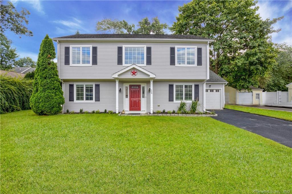 124 Crystal Lake Road Stamford, CT 06905 - Photo 1 of 1 a front view of a house with a garden