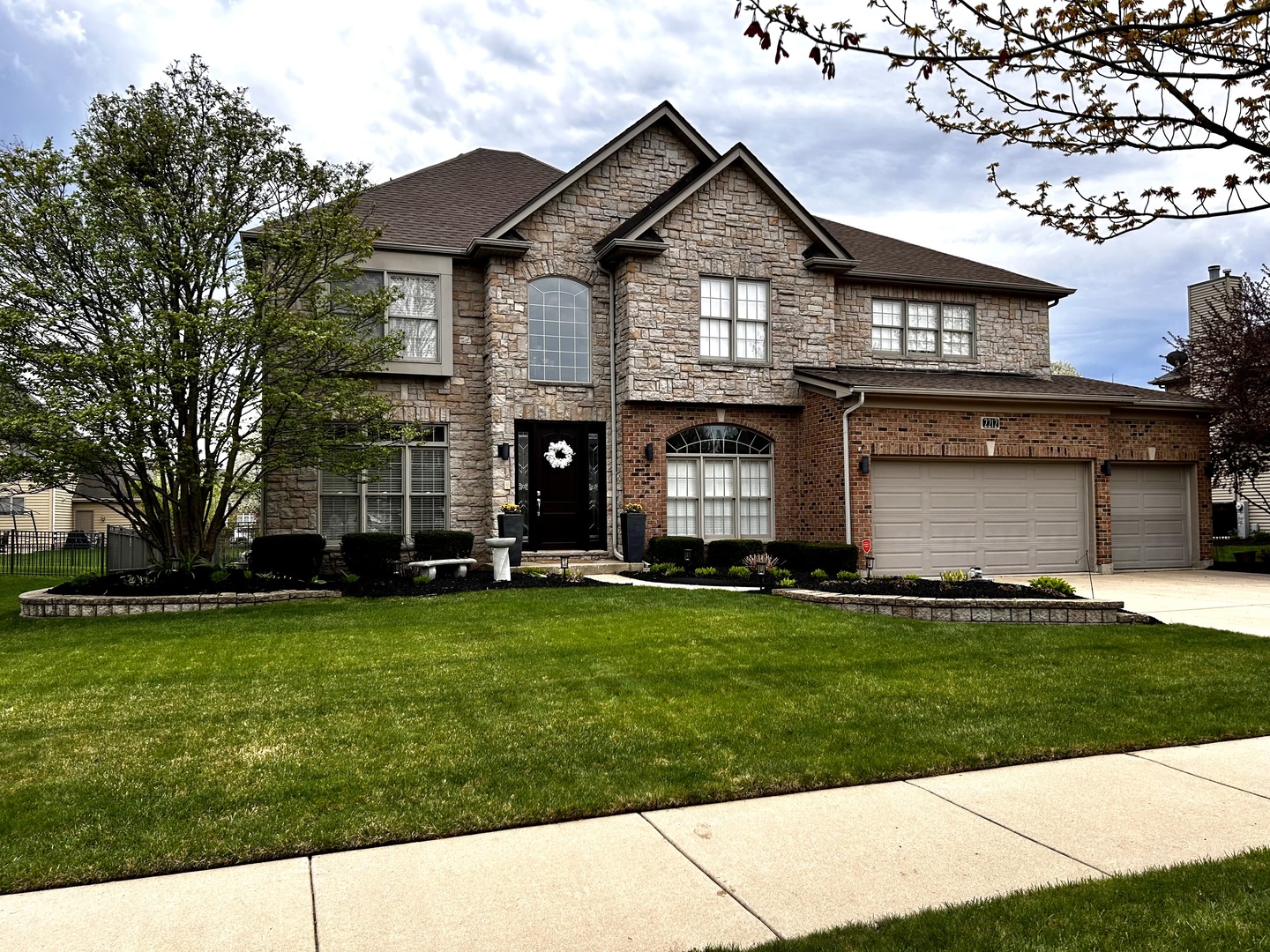 2212 Spartina Road Naperville, IL 60564 - Photo 1 of 17 a front view of a house with a garden
